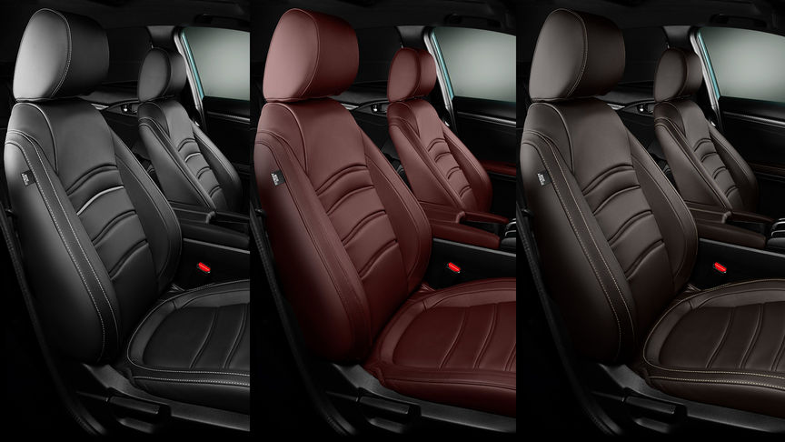 Close-up van Honda Civic 5-deurs leren interieur in Bordeauxrood, Midnight Black en Dark Brown.