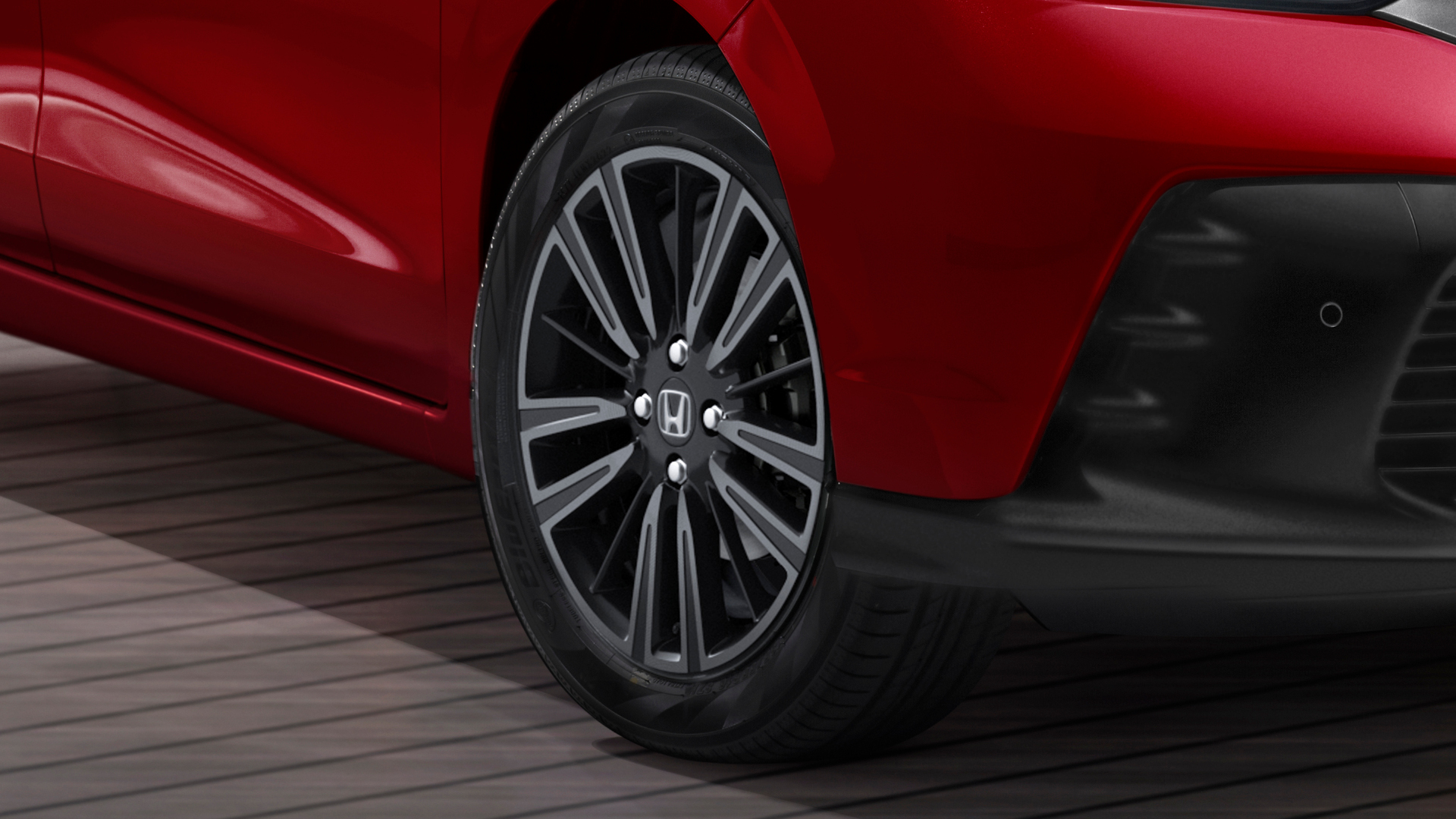 Close up of Honda Jazz wheel alloy.