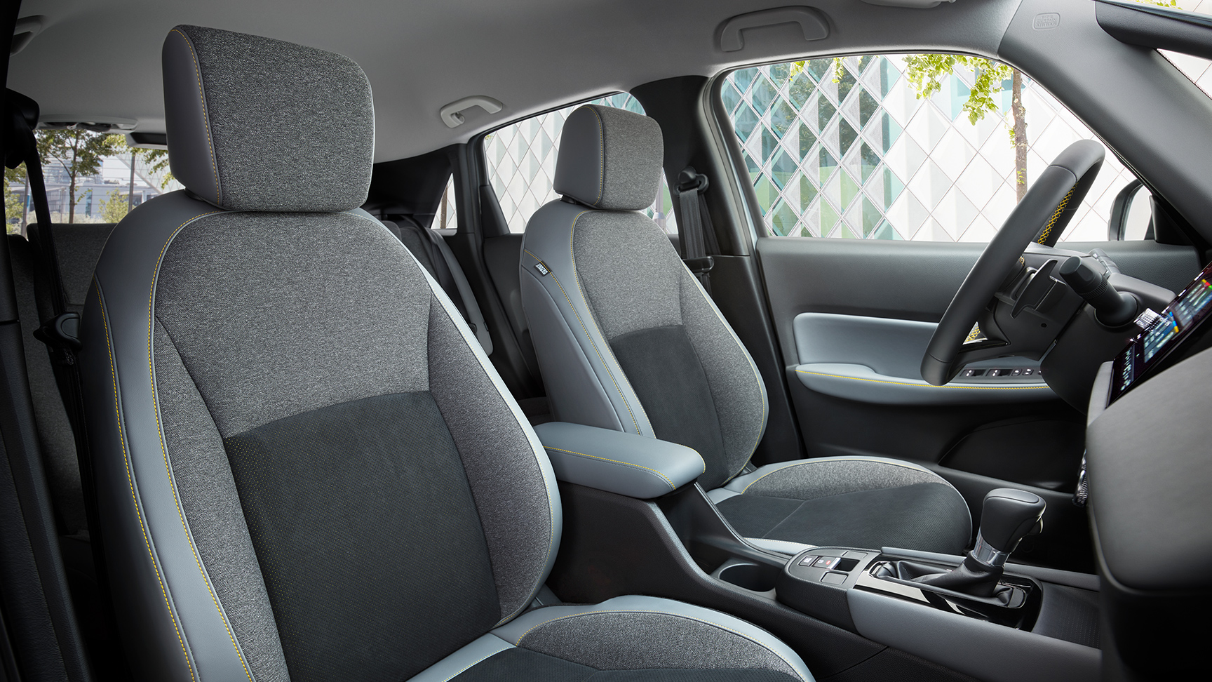 Grey seats with yellow stitching