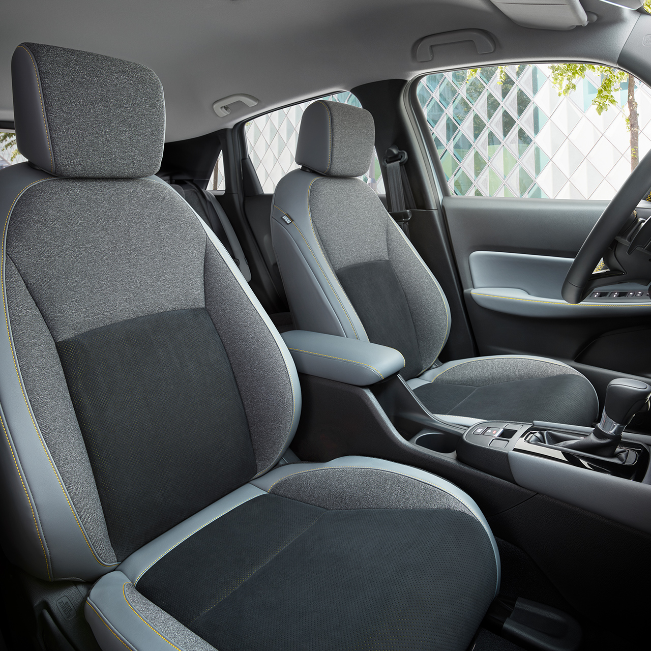 Grey seats with yellow stitching