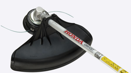Honda ruggedragen bosmaaiers, close-up van Versatool met bosmaaieropzetstuk.