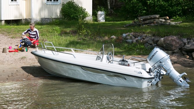 Boat with Honda engine, lake location.