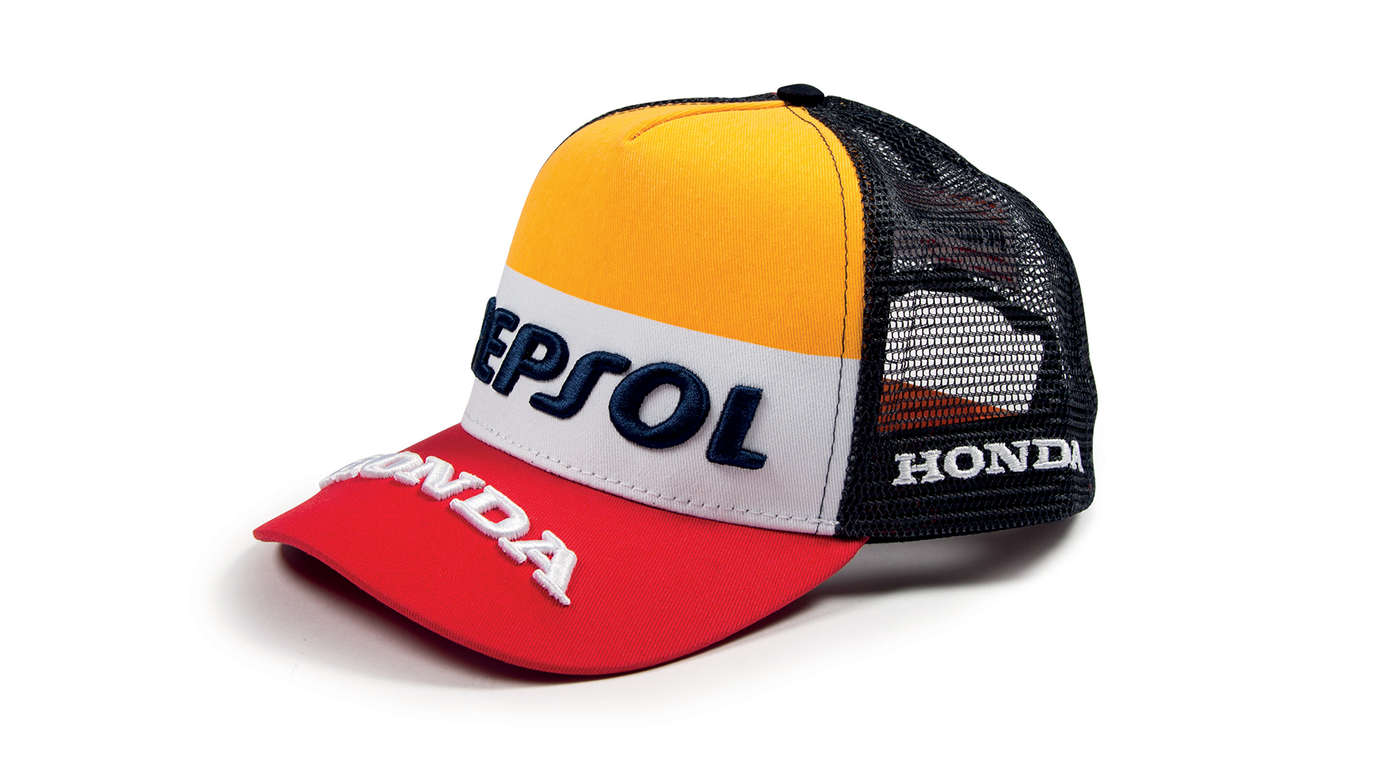 Oranje, witte en rode cap met Honda MotoGP-kleuren en Repsol-logo.