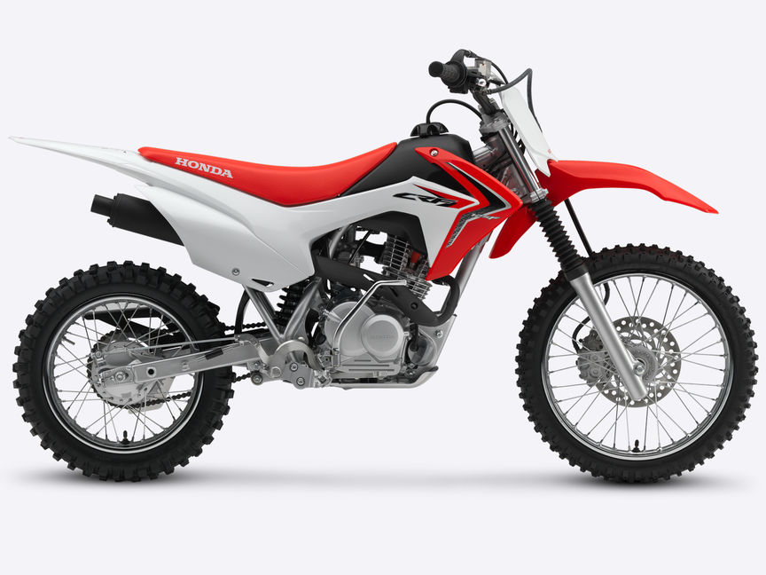 Zijaanzicht, met zicht op rechterkant van rode CRF125F.